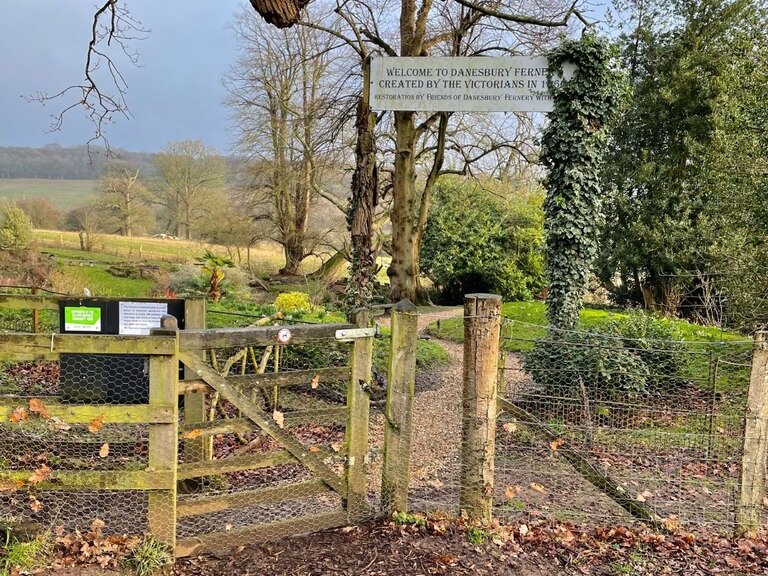 The gate and welcome sign at the entrance to the Danesbury Fernery